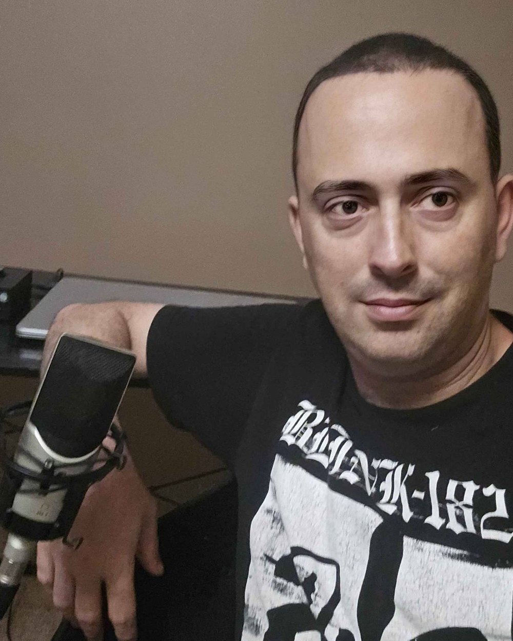 Jarred Thornhill in his home studio, beside his microphone